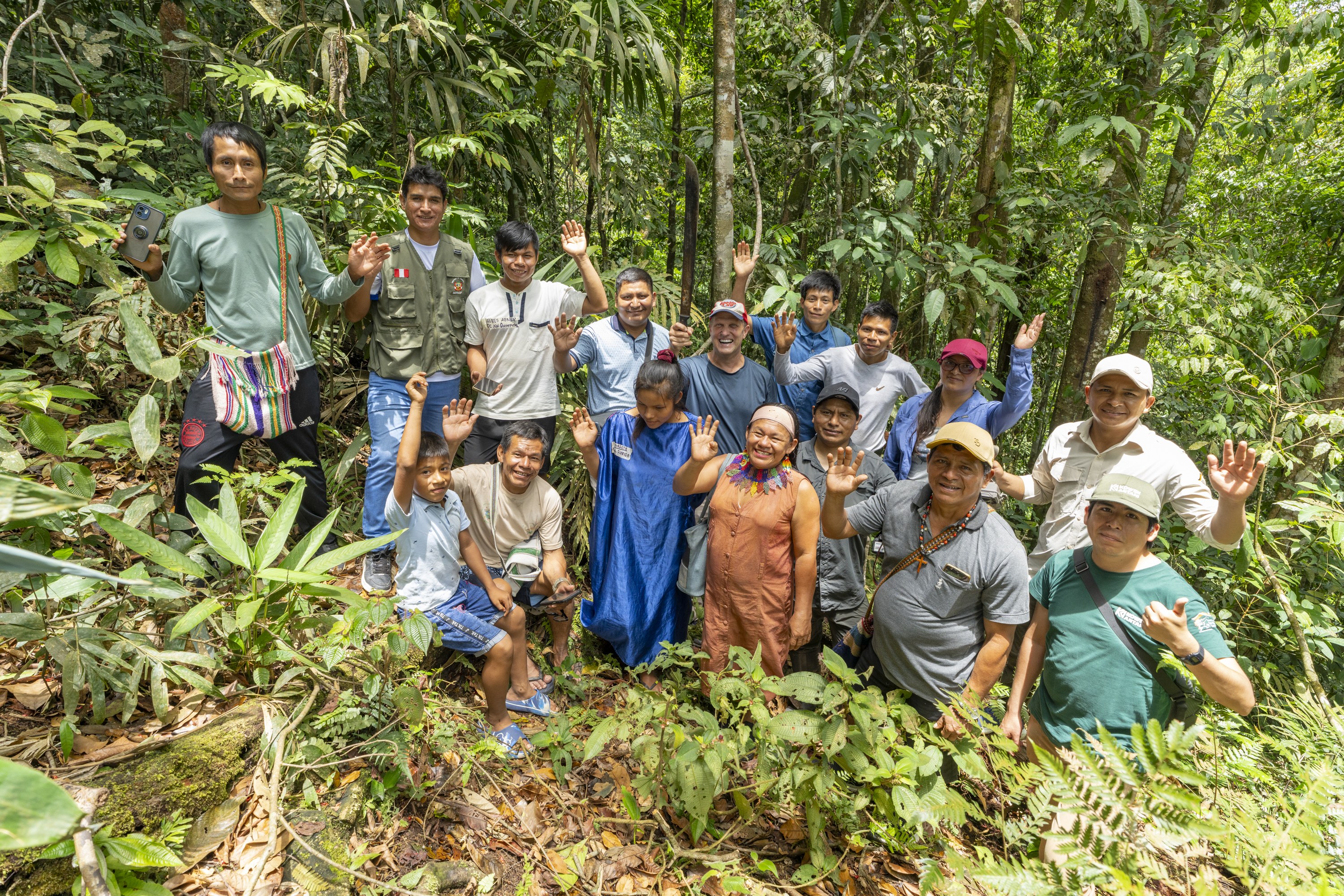 Local field team gathered with MRV partners in the forest
